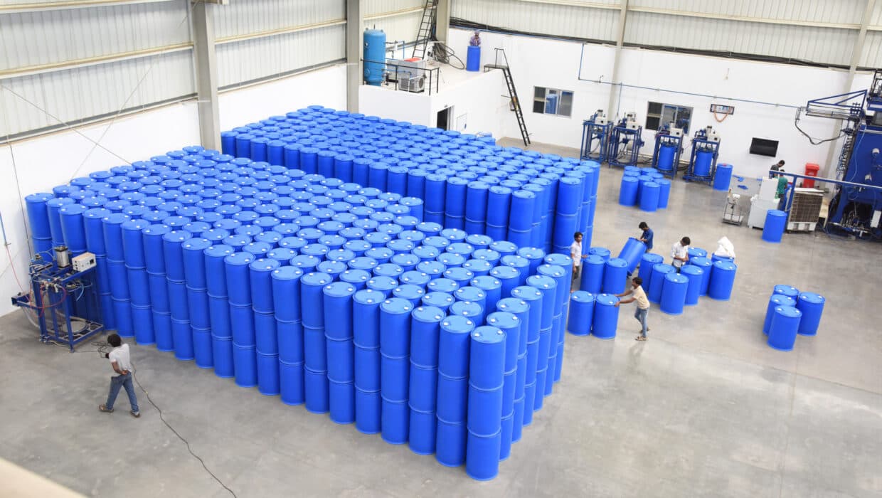 Strategically organized Sharda warehouse with finished blue barrels