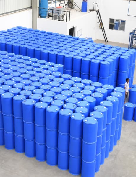 Rows of blue industrial barrels inside the facility